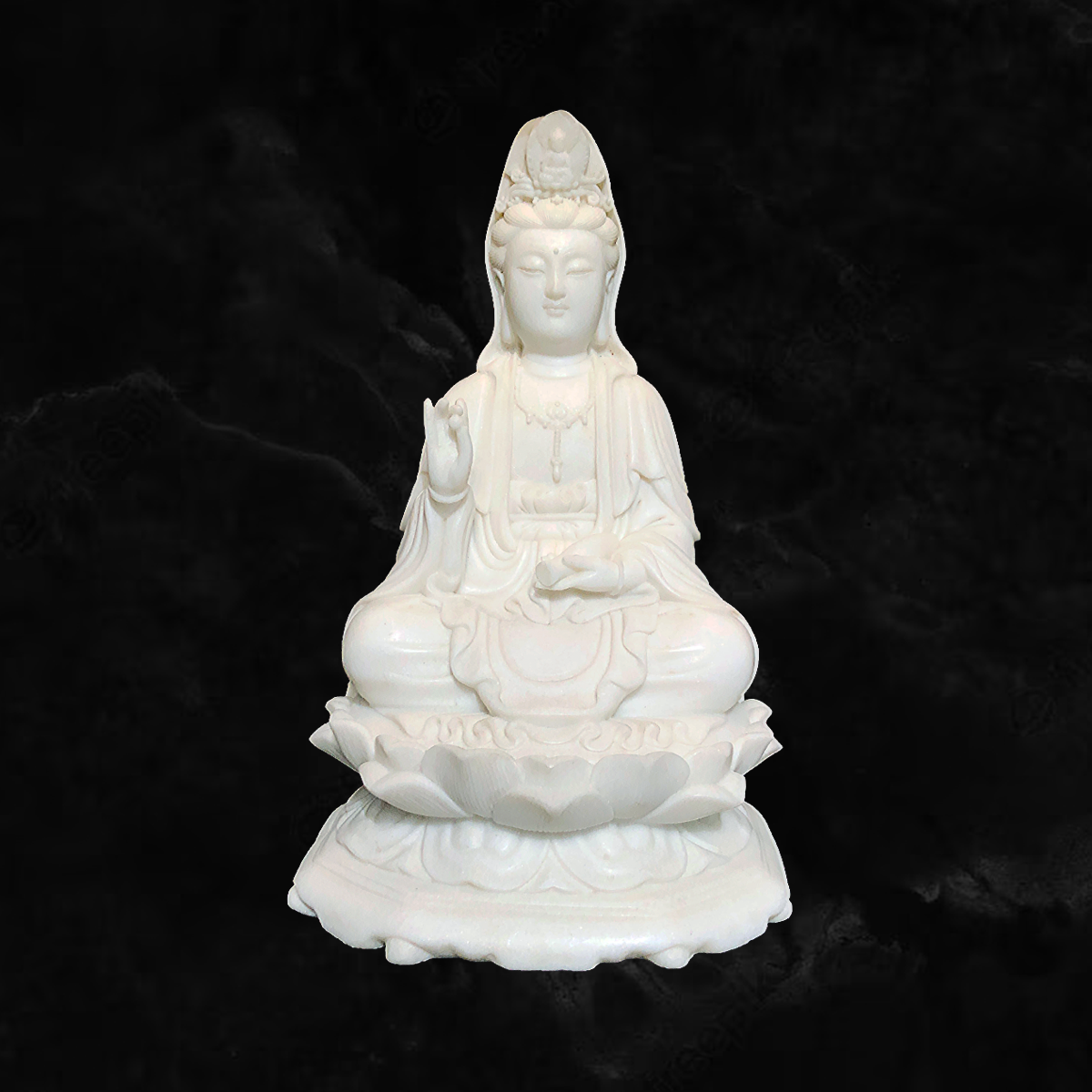 Kuan-Yin sitting on a lotus